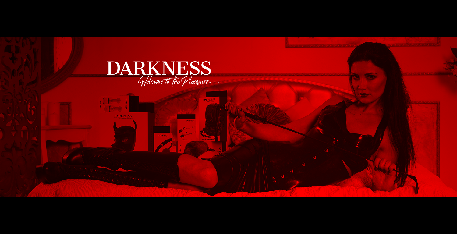 promotional image with a woman lying on a bed, BDSM